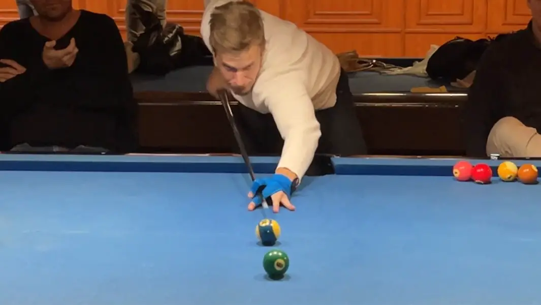Amateur pool player puts pros to shame with record-breaking trick shot