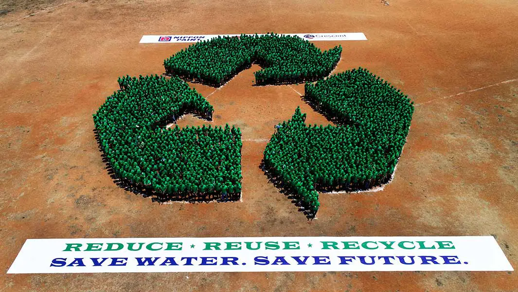 1,726 people form giant human recycling logo for record attempt in India