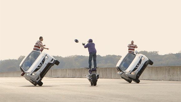 Rugby star Lewis Moody looks on as pro drivers Terry Grant and Lee Bowers pull off record-breaking interception stunt