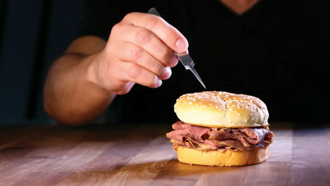 Sandwich chain Arby's produces minuscule advert on sesame seed – then the largest poster ad