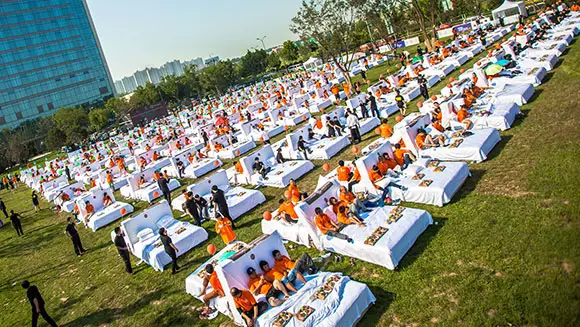 Hundreds share record-breaking breakfast in bed outside hotel in China