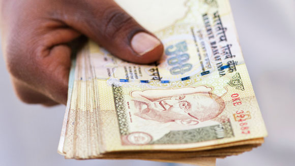 Rupees in someone's hand