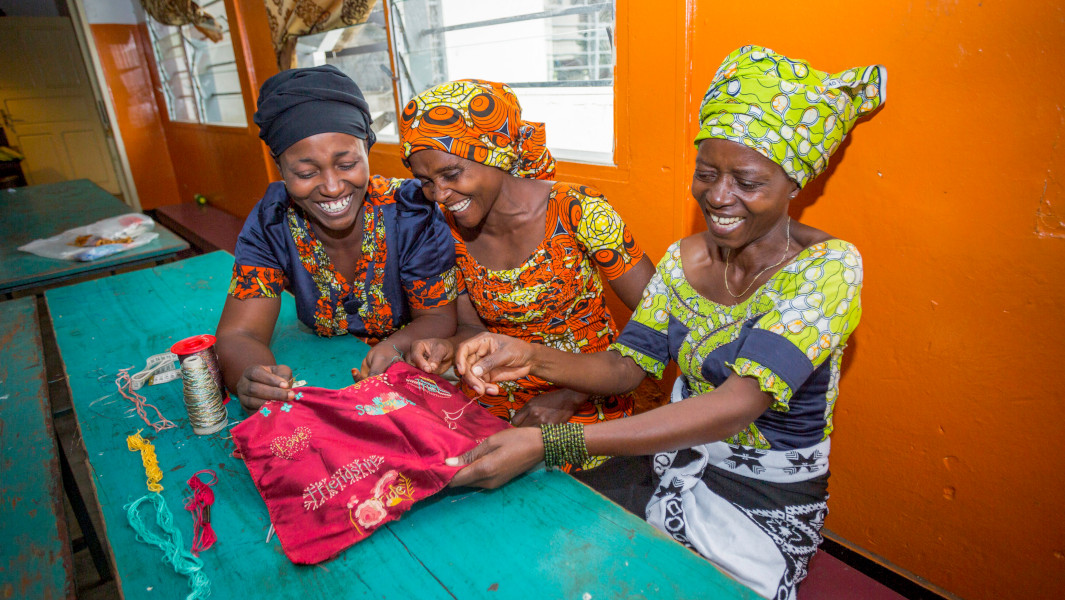 Split image of Kirstie and the dress and Congolese embroiderers stitching the fabric