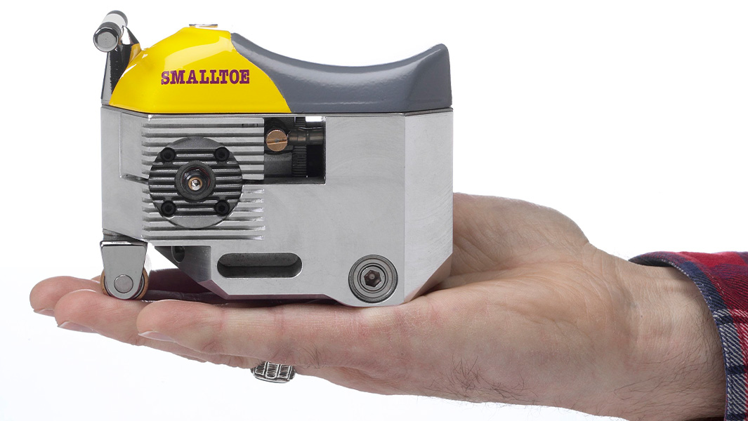 split image of rider on the smallest motorcyle and it being held in someone's hand