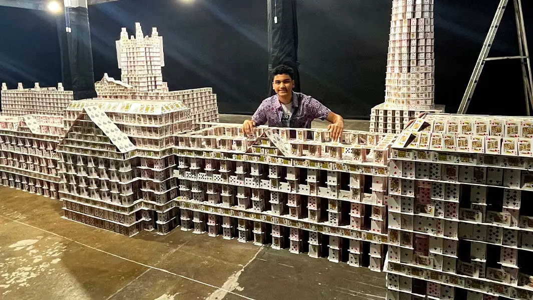 Teen stacks 143,000 playing cards to create world’s largest card structure
