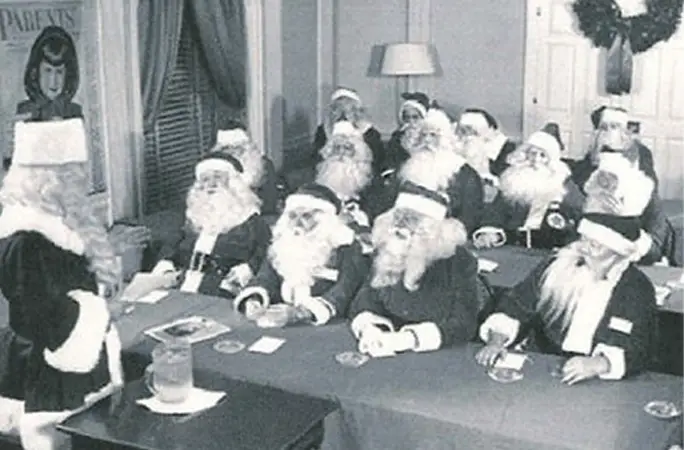 Charles W Howard teaching Santas in his home