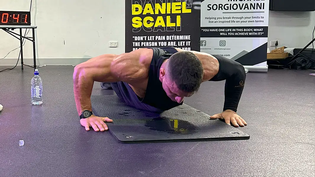 Daniel Scali does 3,249 push ups in one hour to reclaim record