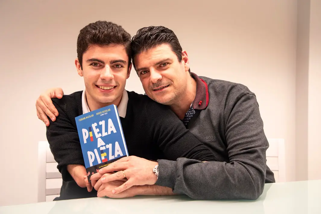David and his dad show their co-written book, 