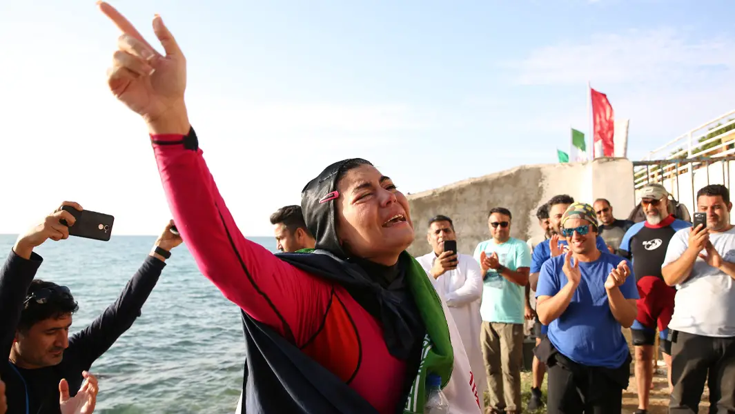 Iranian swimmer challenges taboos in swimwear that adds 6 kg to her weight
