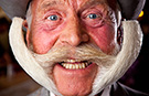 HAPPY MOVEMBER! MOUSTACHE CHAMPION KARL-HEINZ HILLE MAKES IT INTO GUINNESS WORLD RECORDS™ 2014 BOOK