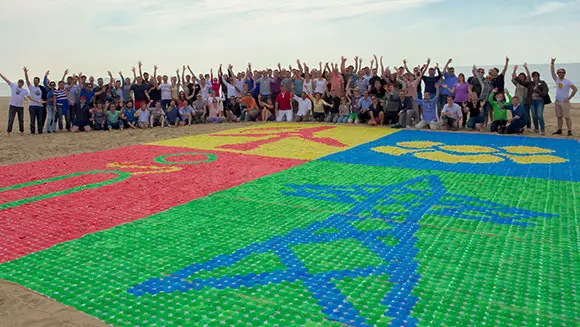RWE Consulting employees create largest drink umbrella mosaic at team-building event in Netherlands