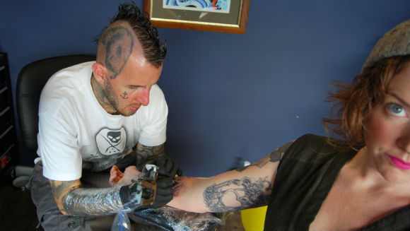 Polish ink king sets Longest tattoo session world record after marathon two-day attempt