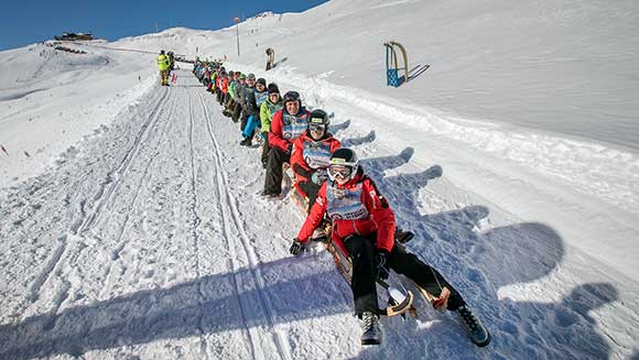 Austrian ski resort hosts world record attempt at the longest chain of sleds