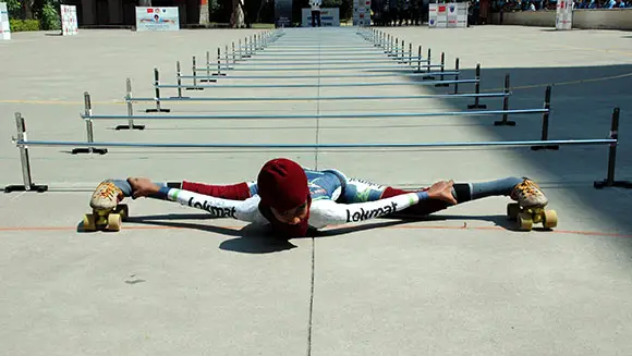 Video: Watch incredible footage as 11-year-old Indian girl smashes lowest limbo skating record