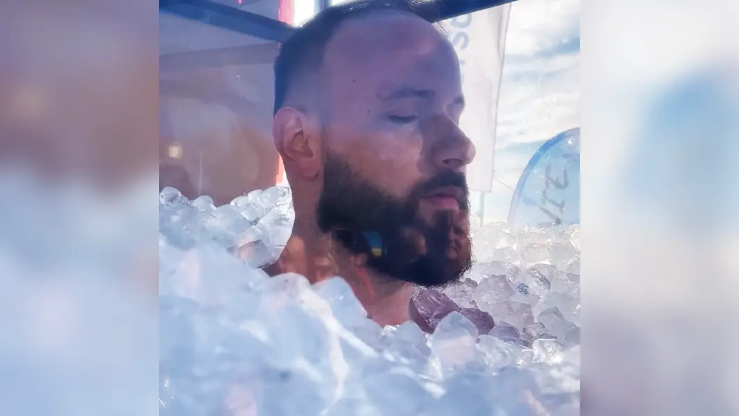 Man spends four hours submerged in ice to smash record