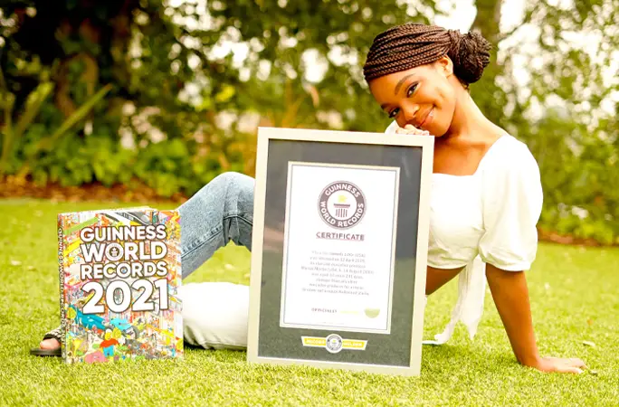 Marsai Martin youngest Hollywood executive producer smiling with Guinness World Records certificate and 2021book