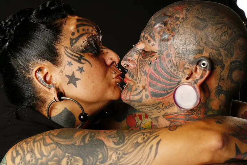 "It's just art": Couple with most body modifications record