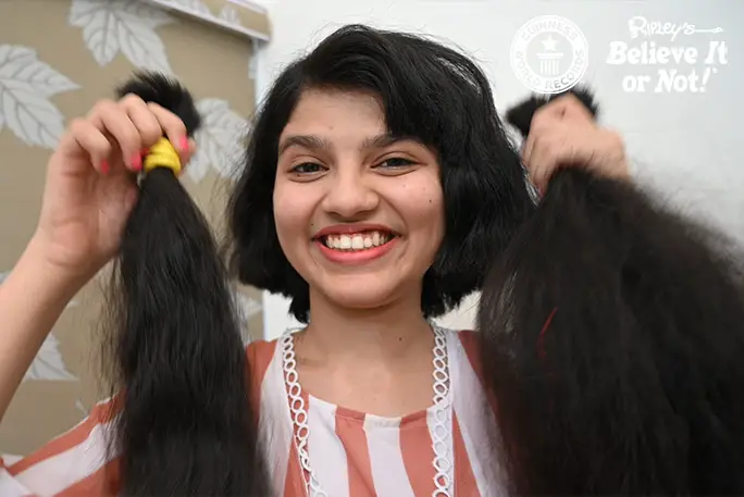 Teen with world's longest hair cuts it off after 12 years of growing it | Guinness  World Records