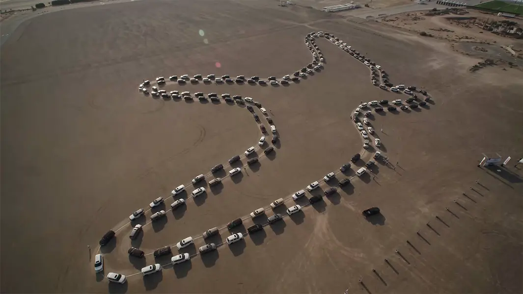 180 Nissans draw huge falcon in Dubai desert as part of record-breaking car dance
