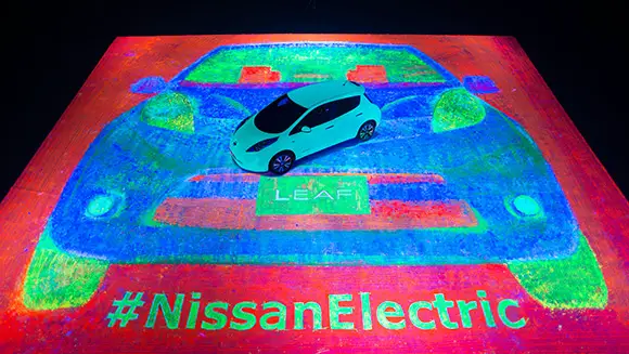 Nissan LEAF car used as a paintbrush to create largest glow-in-the-dark painting ever