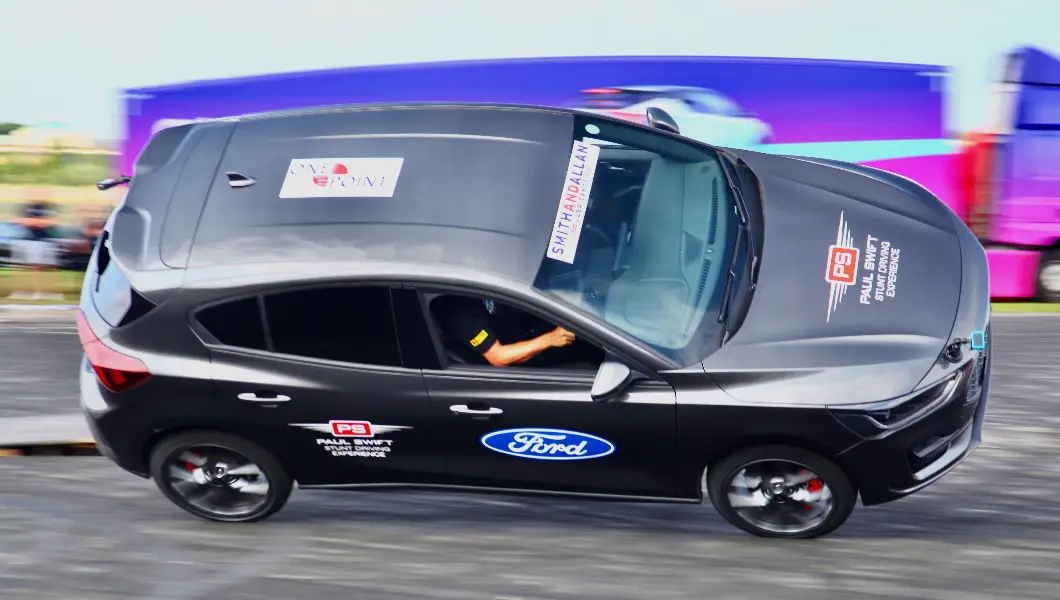 Pro racer Paul Swift smashes nail-biting car stunt record at the British Motor Show