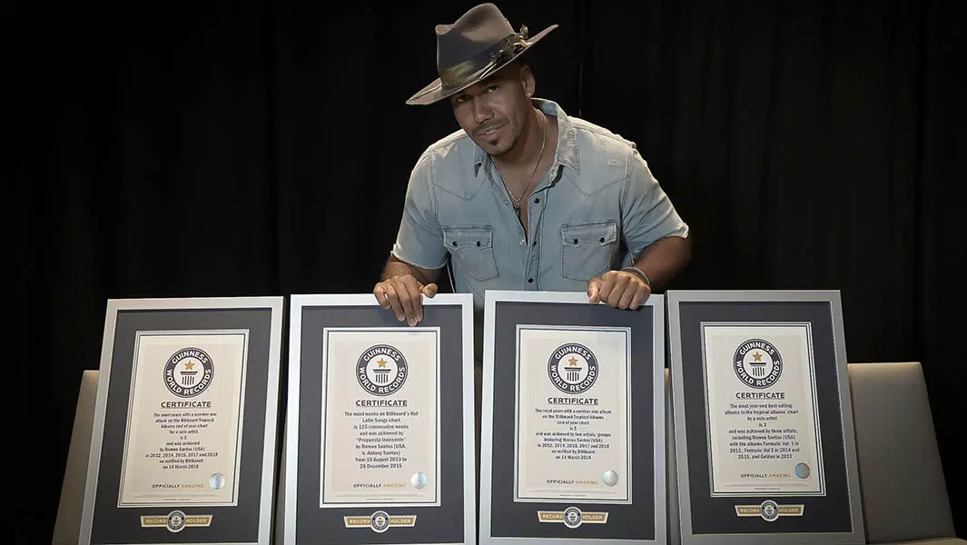 Latin artist Romeo Santos presented with four Billboard Guinness World Records titles