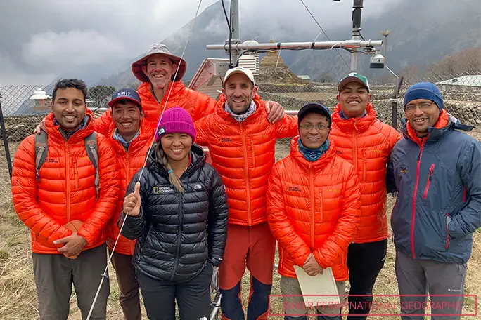 The expedition team from left to right: Nirakar Thapa, Tenzing Gyalzen Sherpa, Baker Perry (behind), Dawa Yangzum Sherpa, Tom Matthews, Subash Tuladhar, Niraj Pradhananga, and Dibas Shrestha after servicing the Phortse weather station