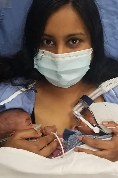 Shakina tandem holding the twins for the first time