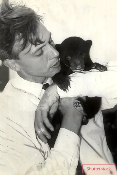 Attenborough with Malaysian sun bear cub Benjamin in Borneo in 1956, while shooting Zoo Quest