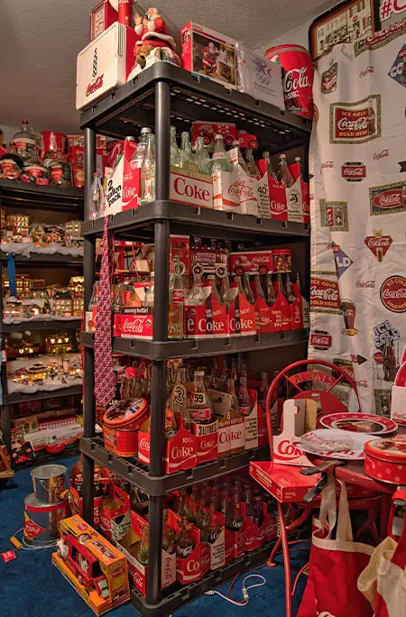 coca cola memorabilia bottles on shelf