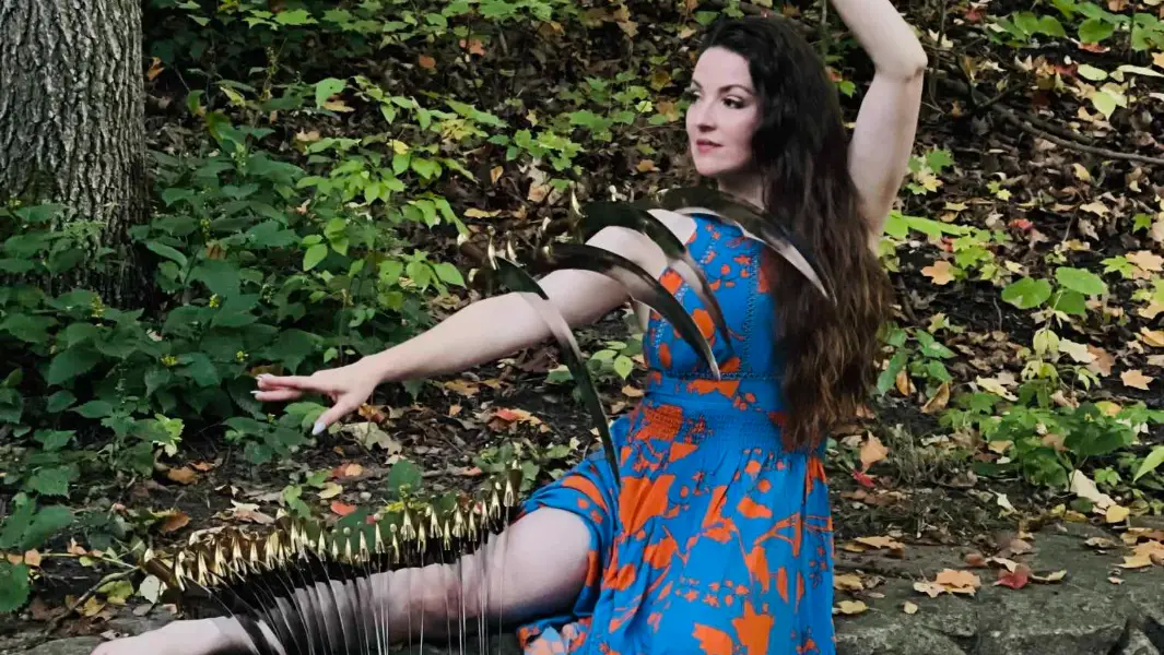 Belly dancer daringly balances 30 swords on her body in just one minute