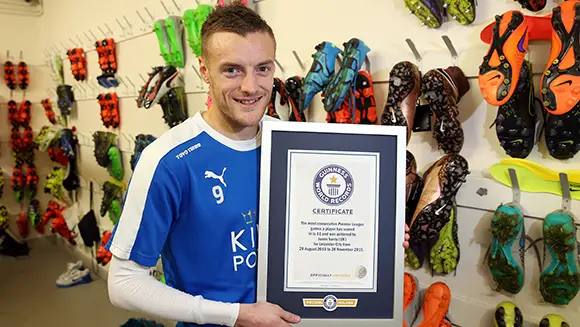Leicester City striker Jamie Vardy is presented with GWR certificate in honour of his record goal-scoring run