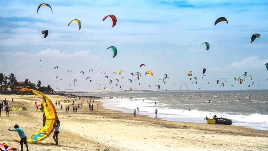 Hundreds of kite surfers ride the waves to raise awareness of ocean pollution