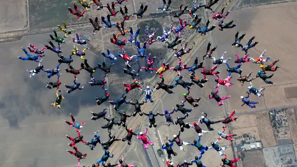 Classics: Watch International group of female skydivers set spectacular new record for largest sequential freefall formation 