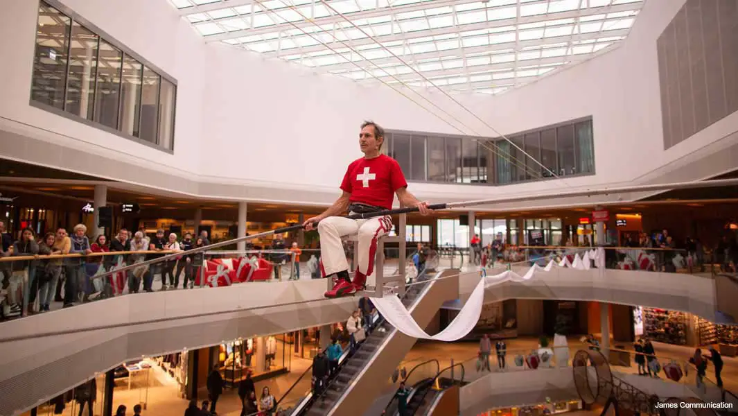 Daredevil spends eight hours sat balancing on a chair on a tightrope in a shopping mall