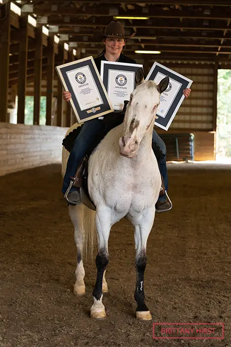 morgan-wagner-smiling-as-she-sits-on-endo-and-holds-his-gwr-certificates.jpg
