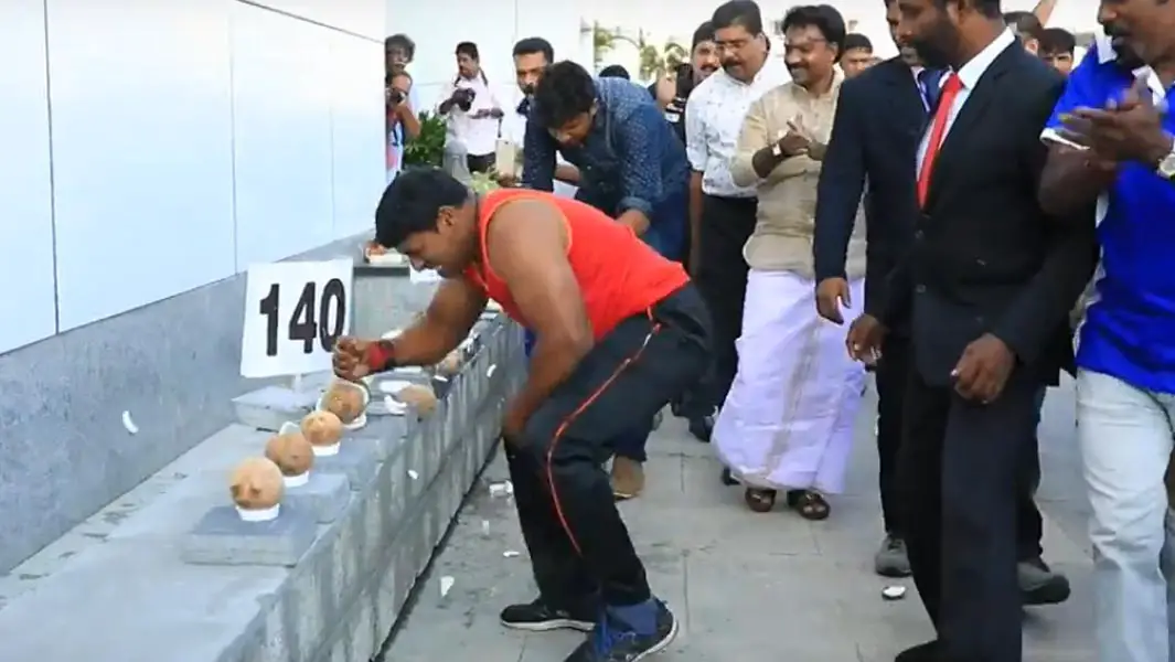 Indian man smashes his way to new record by breaking open coconuts with his hand