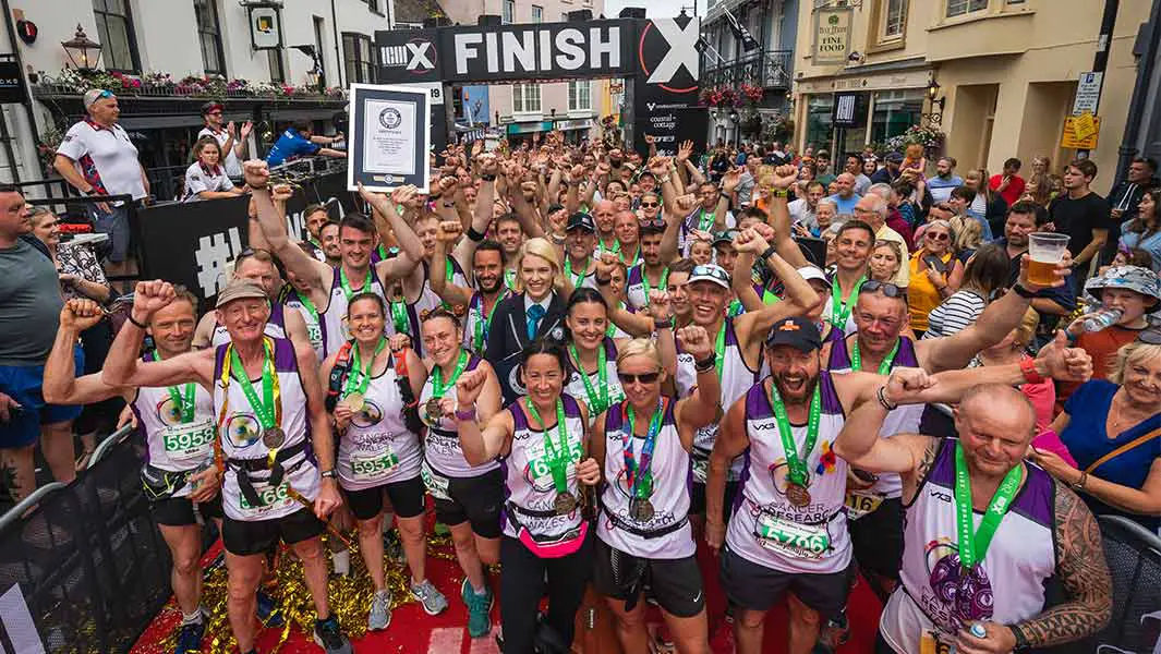 122 people run marathon linked together to raise money for Cancer Research Wales