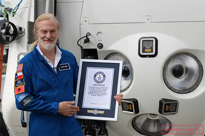 victor-vescovo-with-limiting-factor-submersible-and-guinness-world-records-certificate-for-deepest-crewed-dive