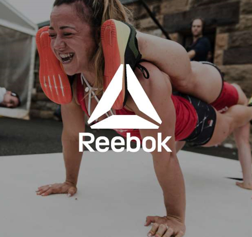 Reebok - woman doing a plank on top of another woman