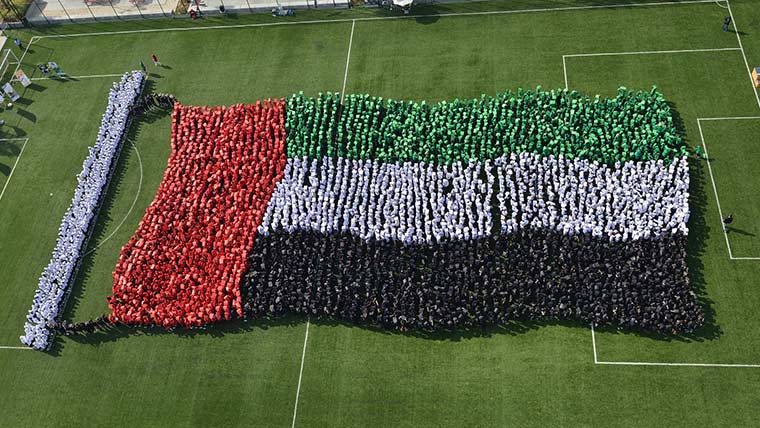 Largest human image of a waving national flag case study