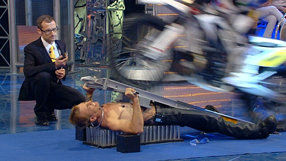 Most-Motorcycles-Driven-Over-the-Body-on-a-Bed-of-Nails-guinness-world-records