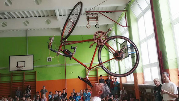 Longest duration balancing a bicycle on the chin header