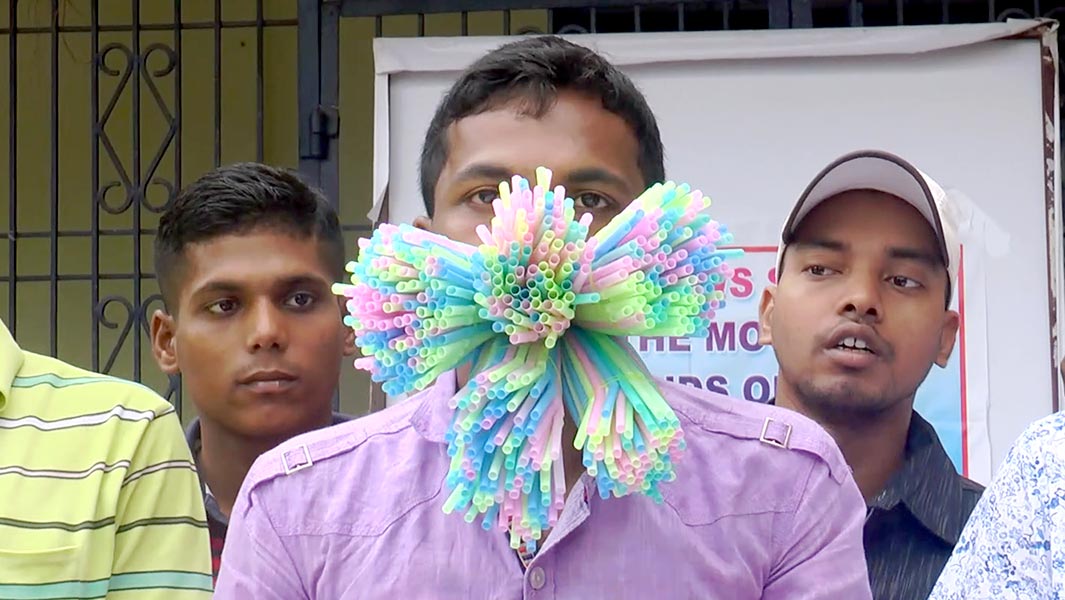 Most straws stuffed in the mouth header