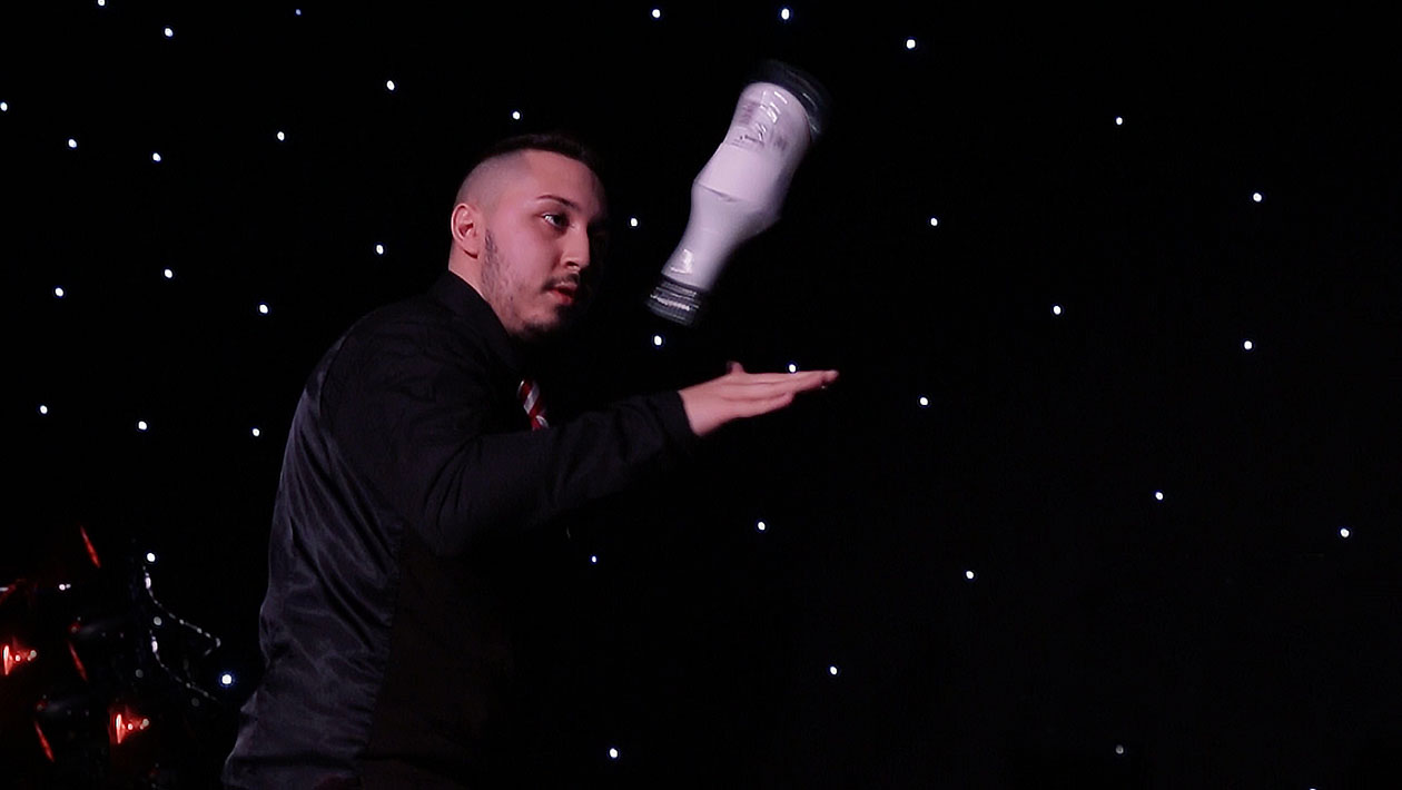 Most flips of a bottle on the back of a hand header