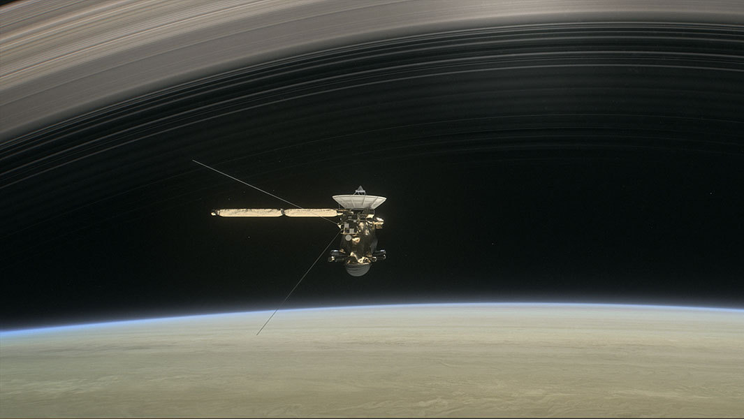 Artists rendering of Cassini diving between Saturn and the planets innermost ring Image credit NASA JPL-Caltech