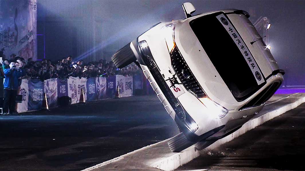 Narrowest platform driven across on two wheels in a car