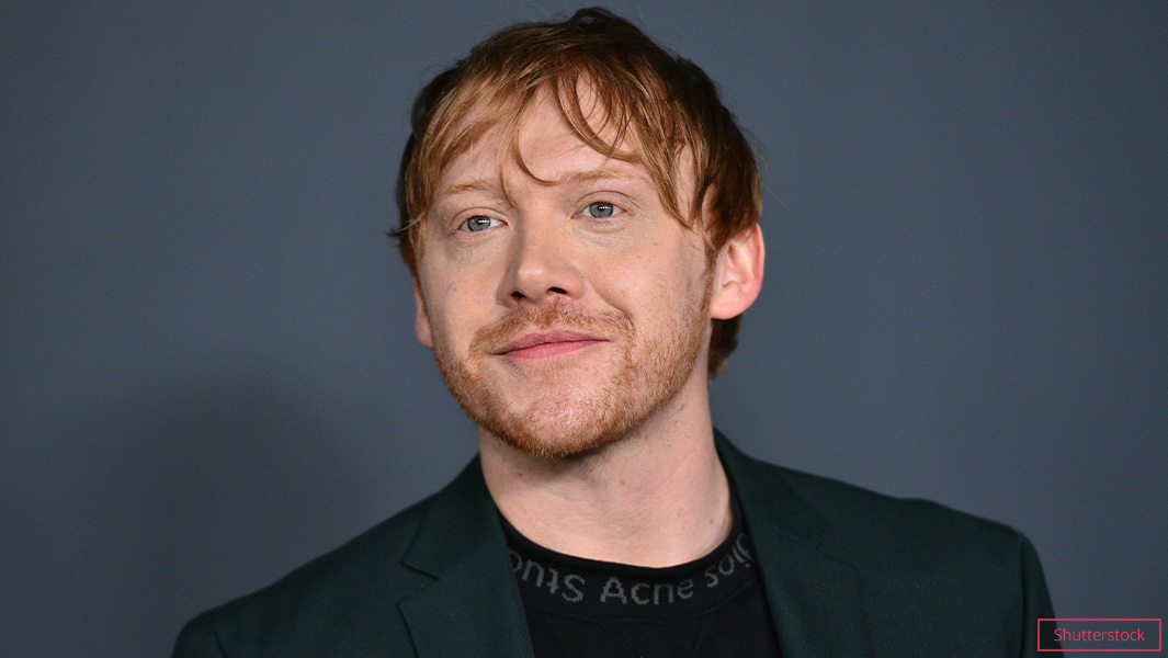 rupert grint with grey background