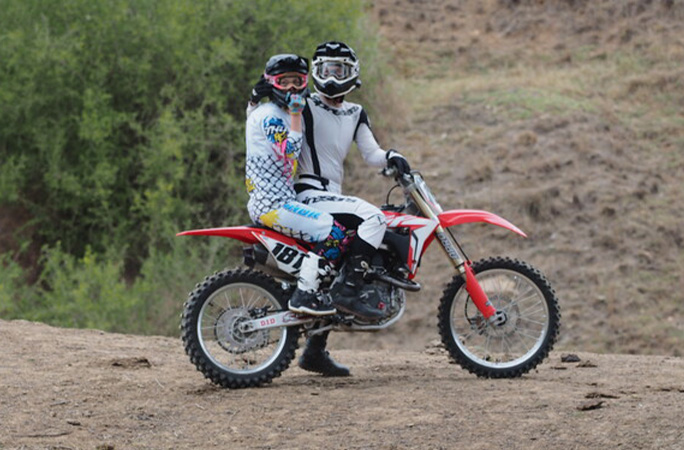 Couple break 20-year record with most dangerous motorbike stunt they've ...