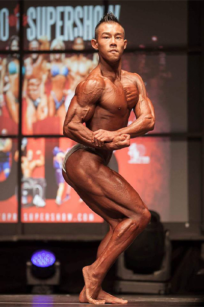 Wallace representing Canada in a bodybuilding competition